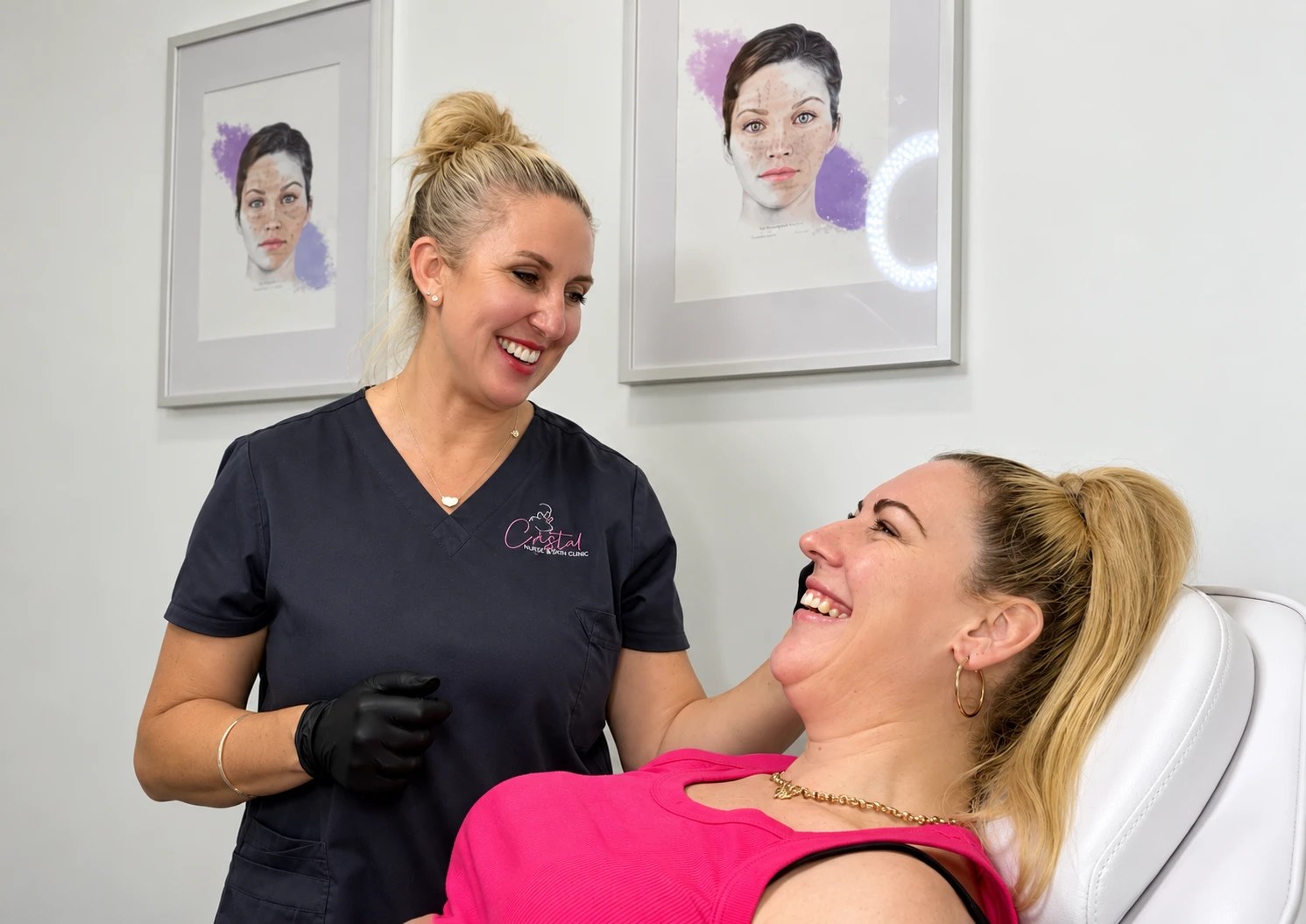 Sue Arber laughing with a client in the treatment room
